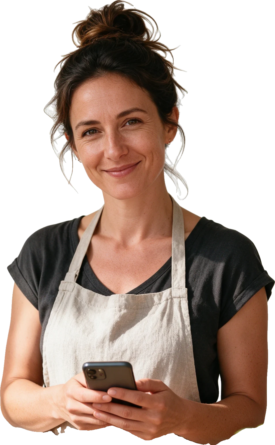 A small business owner today, holding her phone